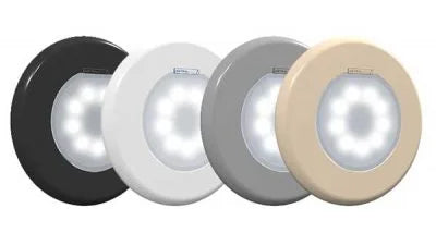 Fyra cirkulära LED-nattlampor i svart, vit, grå och beige.