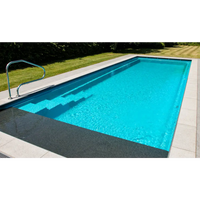 Leisurepools Cube modern pool med turkost vatten och metallräcke