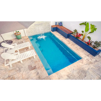 Leisurepools Harmony rektangulär pool med blåvatten, liten vattenfall och kaklad däck