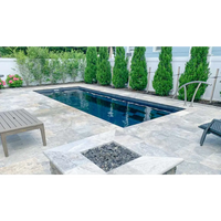 Leisurepools Harmony rektangulär pool med mörkblått vatten och grå stenar