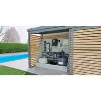 Svart cylindrisk poolfilter för Minipool Wellness Pool 2.25×3.75 m med metallrör och paneler på ljusgrön skåp