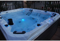 Vit PassionSpa Desire Spabad med vit bad, blå LED-belysning och svarta accenter