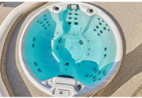 Vit PassionSpa Recharge Spabad – Pure Collection med turkost vatten och svarta jetmunstycken