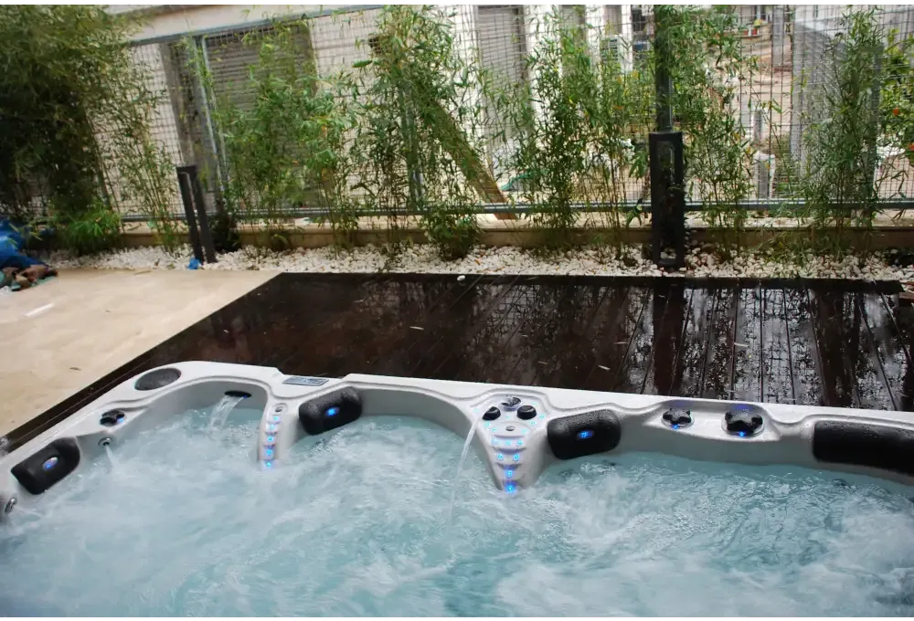 Grå och svart PassionSpa Theater Spabad med blå LED-belysning
