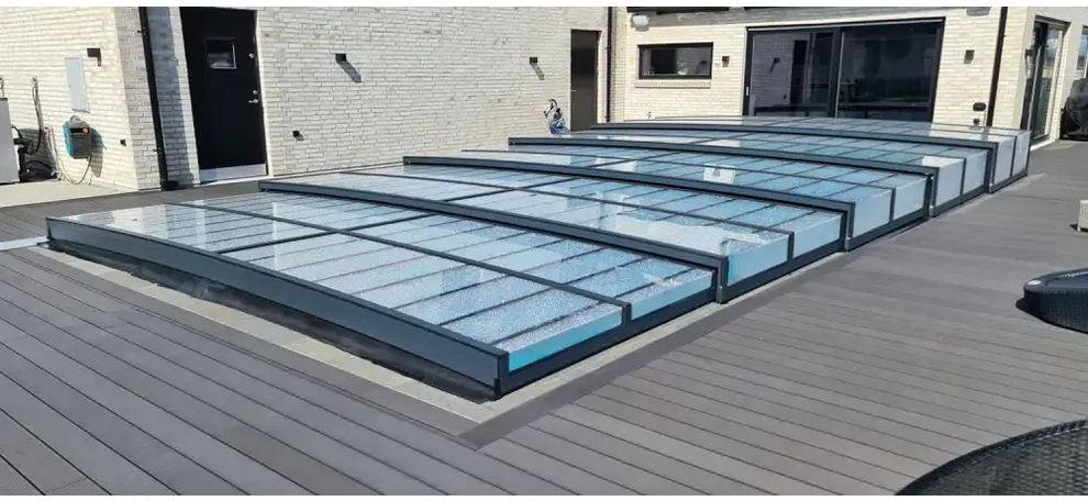 Modern glass roof panels with black frames over wooden deck, Pooltak Icon Kit