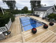 Elegant pooltak Sydney med enkelskena antracit med blå poolvatten